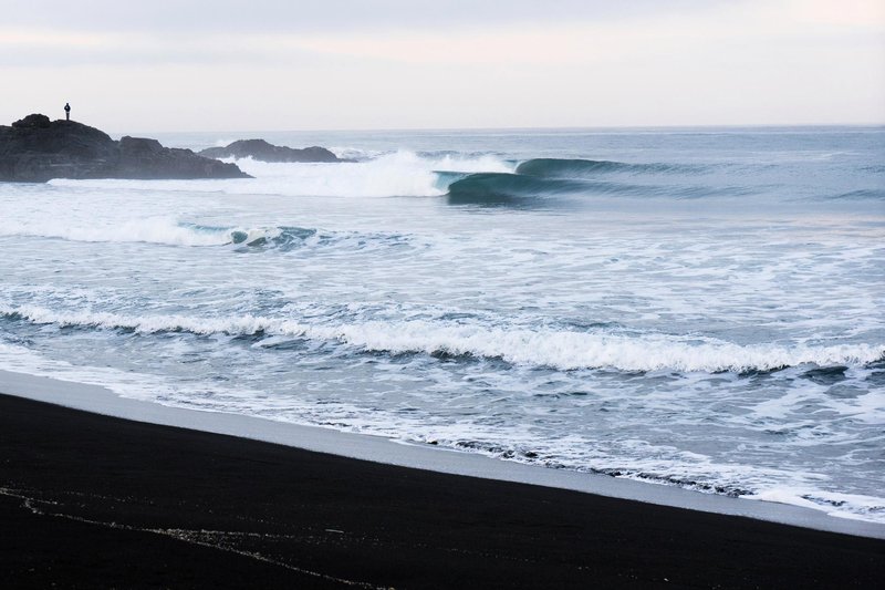 mark mcinnis perfect-surfing-waves-break-on-deserted-beach-in-chile-south-america
